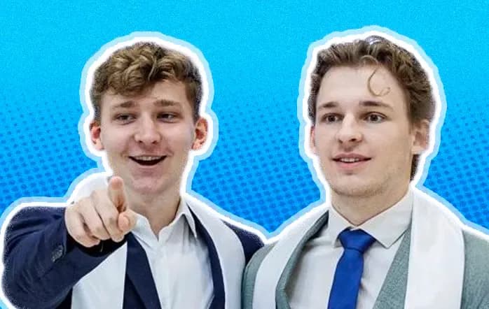 The Nordify team: two founders in suits, one pointing at the camera and laughing
